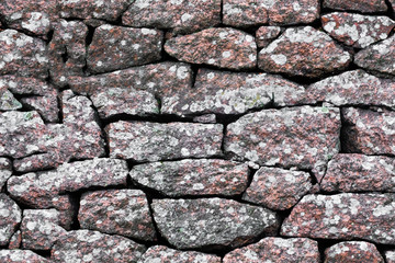 Poster - seamless texture. stone wall made of boulders of granite.