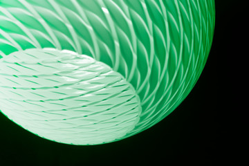 Poster - toned photo of luminous lampshade in darkness. close-up of lighting fixture. abstract architecture d