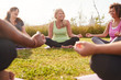 © Monkey Business - Group Of Mature Men And Women In Class At Outdoor Yoga Retreat Sitting Circle Meditating