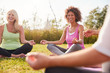 © Monkey Business - Group Of Mature Men And Women In Class At Outdoor Yoga Retreat Sitting Circle Meditating