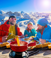 Leinwandbilder - Fondue cheese, swiss winter ski holidays break for lunch, mountain view Matterhorn in Zermatt, Switzerland.