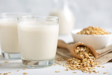 Oat milk. Healthy vegan non-dairy organic drink with flakes