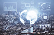 © peshkova - Forex chart on cityscape with skyscrapers wallpaper double exposure. Financial research concept.