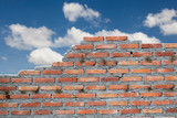 Fototapeta  - old brick wall with cloud and blue sky
