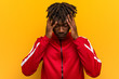 © Asier - Young fitness black man touching temples and having headache.