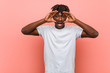 © Asier - Young african black man keeping eyes opened to find a success opportunity.