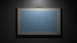 Empty Modern Style Frame On The Grey Wall In The Dark Room
