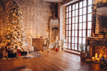 Warm Cozy Evening Luxury Christmas Room Interior Design, Xmas Tree Decorated By Gold Lights Presents Gifts, Candles,mirror Garland Lighting Fireplace.holiday Living Room. New Year Holidays Concept