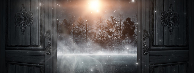 Open doors. Abstract bokeh light. Night view, magical atmosphere.