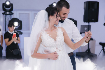 First dance of groom and bride in restaurant. Elegand bride dance with handsome groom