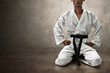 © fotokitas - Karate martial arts fighter sitting