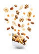 © winston - Dried fruits jumping out white bowl on white background