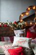 © Сергей Уланов - Cozy bed with Christmas pillows decorated with Christmas decor
