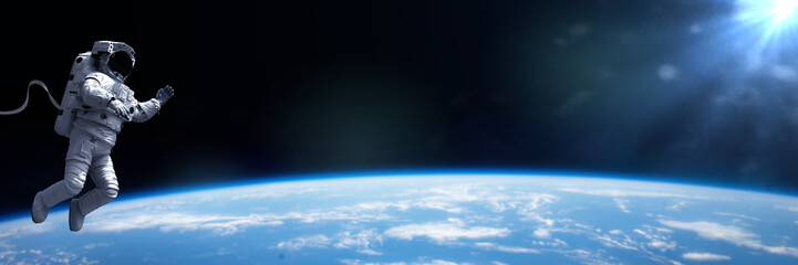 Wall Mural - astronaut in eva spacesuit performing a spacewalk