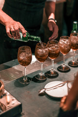 Wall Mural - Bartender making cocktails at the bar, alcoholic drinks  