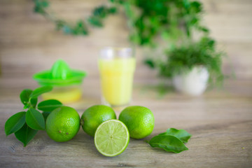 Lime or lemon juice with wood plank background