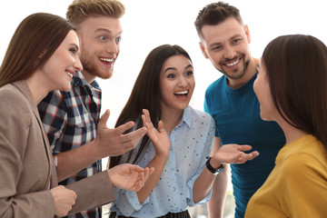 Canvas Print - Group of happy people talking in light room