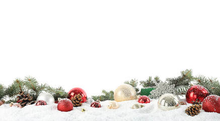 fir branches, christmas decoration and snow against white background