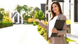 © New Africa - Beautiful real estate agent with documents outdoors