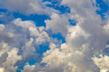 Poster - Blue sky with white clouds. Heaven. Cumulus. Cloudiness. Dreams. Weather forecast. Romance. Natural background. Background with clouds.