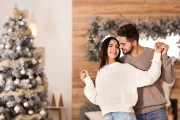 Sticker - Happy couple in living room decorated for Christmas