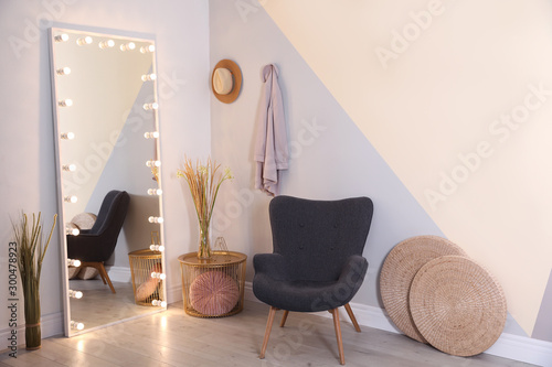 Fotomural Large mirror with lamps in stylish room interior