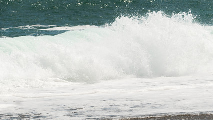 Sea surf blue waves and white foam