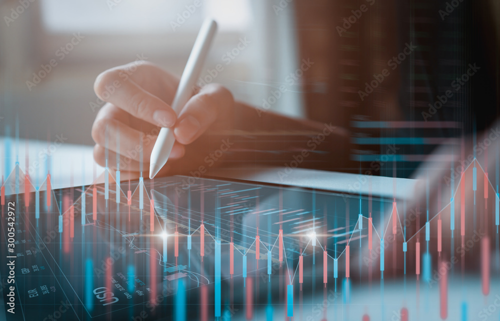 Stock exchange market concept, businessman trader looking on tablet with graphs analysis candle line in office room, diagrams on screen. - obrazy, fototapety, plakaty 