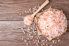 Himalayan Pink Salt Crystals On Wooden Board, Scrub Spa Therapy Healthy. Top View With Copy Space.