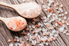 Himalayan Pink Salt Crystals With White Salt On Wooden Spoon, Scrub Spa Therapy, Cooking Healthy Ingredient.