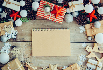 Wall Mural - Christmas background with letter and gift boxes on the wooden ta