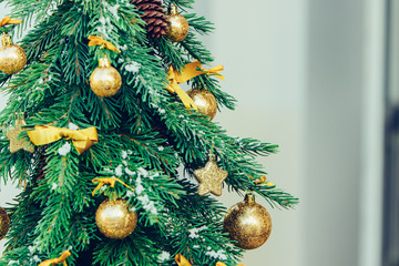Wall Mural - Green fir tree with golden balls. Christmas wallpaper.