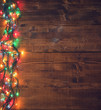 © k2photostudio - Empty rustic wooden background with Christmas lights