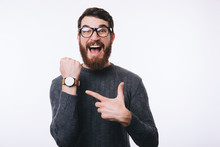 Photo Of Amazed Bearded Man Pointing At Watch