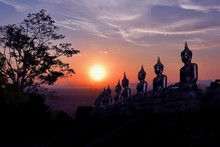 The Golden Buddha Statue Of Phu Salao Temple In Beautiful Sunset Moment At Pakse
