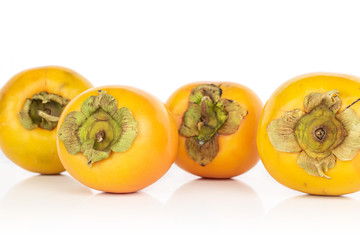 Wall Mural - Group of four whole sweet orange persimmon isolated on white background