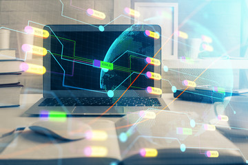 Multi exposure of table with computer and world map hologram. International data network concept.