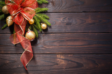 Wall Mural - golden and red Christmas  decorations on dark wooden background