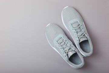 men's sneakers on a colored background top view. men's footwear. minimalism