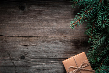Wall Mural - Christmas green frame from fir branches on a vintage gray board background. Frame of fir branches. Christmas card blank.