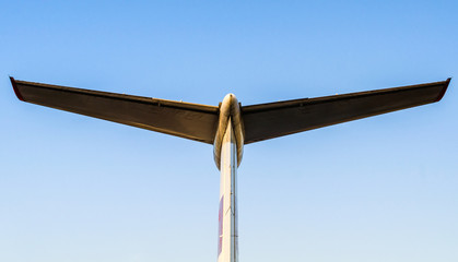 Wall Mural - wings of a large airliner on a blue background