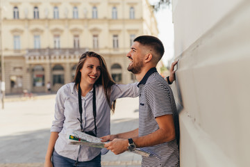 young couple tourists in sightseeing in town