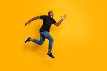 Full Size Profile Side Photo Of Funky Crazy Afro American Guy Jump Go Run After Black Friday Discounts Wear Stylish Trendy Clothing Isolated Over Yellow Color Background