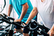 © Daniel - couple of two seniors training at the gym on the cyclet together - healhty lifestyle concept - active pensioner people working hard