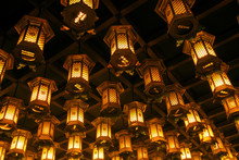 Thousands Of Lanterns Hanging On The Ceiling Of Buddhist Temple Shrine.