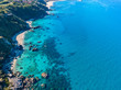 Aerial view of Tropea beach, crystal clear water and rocks that appear on the beach. Calabria, Italy