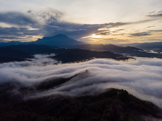 Canvas Print - Rural landscape with dramatic sea of cloud during sunrise with Mount Kinabalu at Saba, Borneo