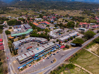 Wall Mural - Aerial drone image of Small town with beautiful rural landscape surrounding of paddy field at Tambuanan Town, Sabah, Malaysia 
