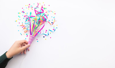 Wall Mural - celebration party and anniversary concepts ideas with woman hand holding colorful confetti,paper art