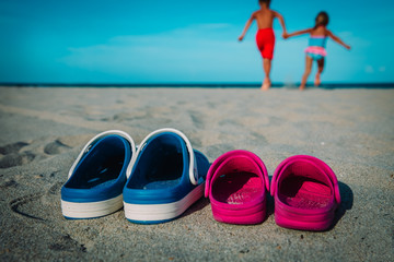 Poster - kids run to swim at beach, family at sea